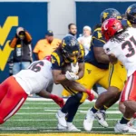 Hawkins leads Mountaineers to game-winning kick against Bearcats
